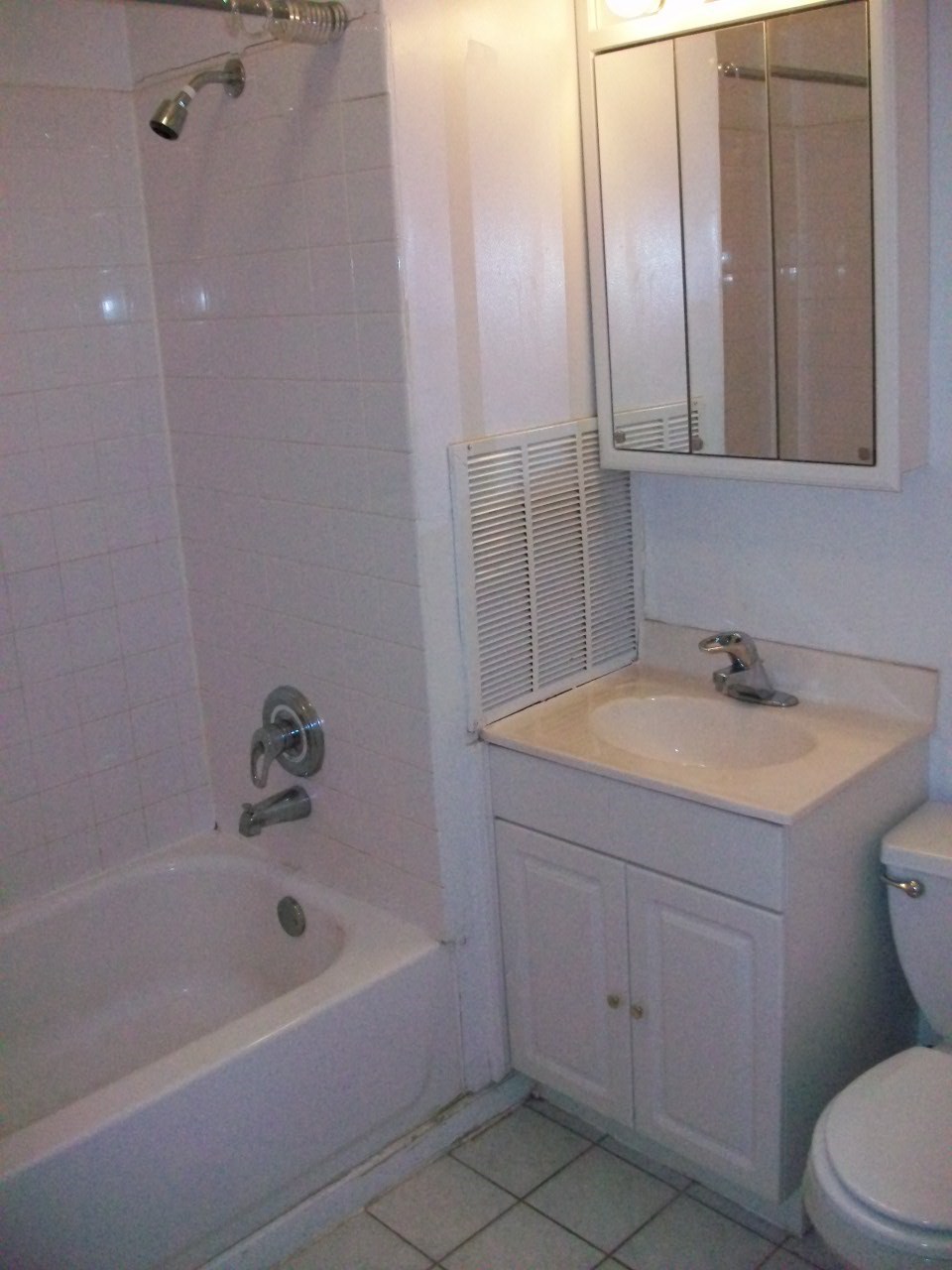 a bathroom with a sink and a tub and a toilet