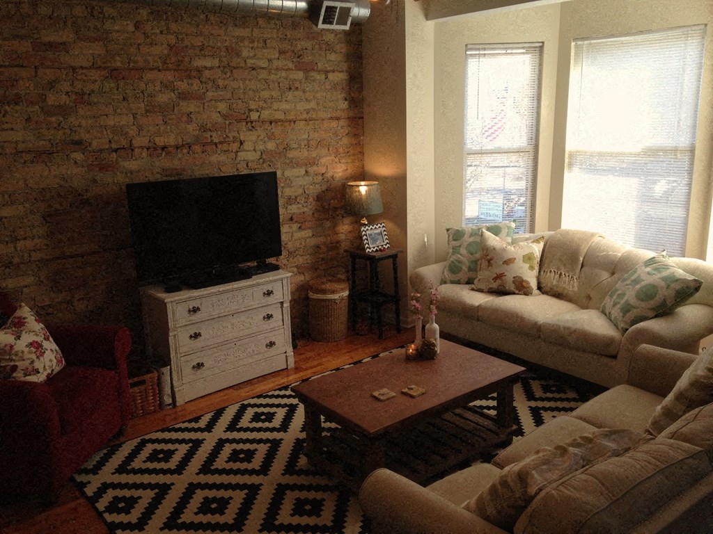 a living room with two couches and a television