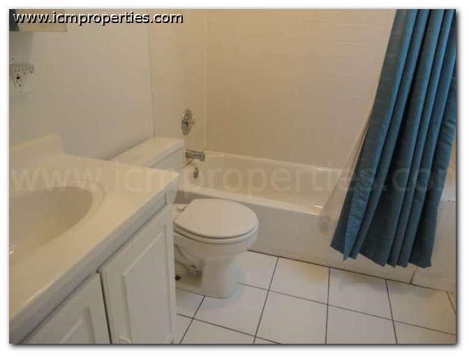 a bathroom with a toilet and a sink