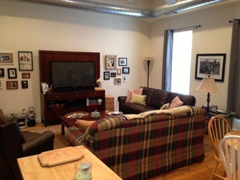 a living room with a couch and a tv