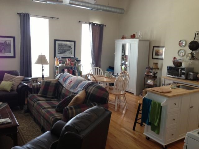 a living room with a couch and a table