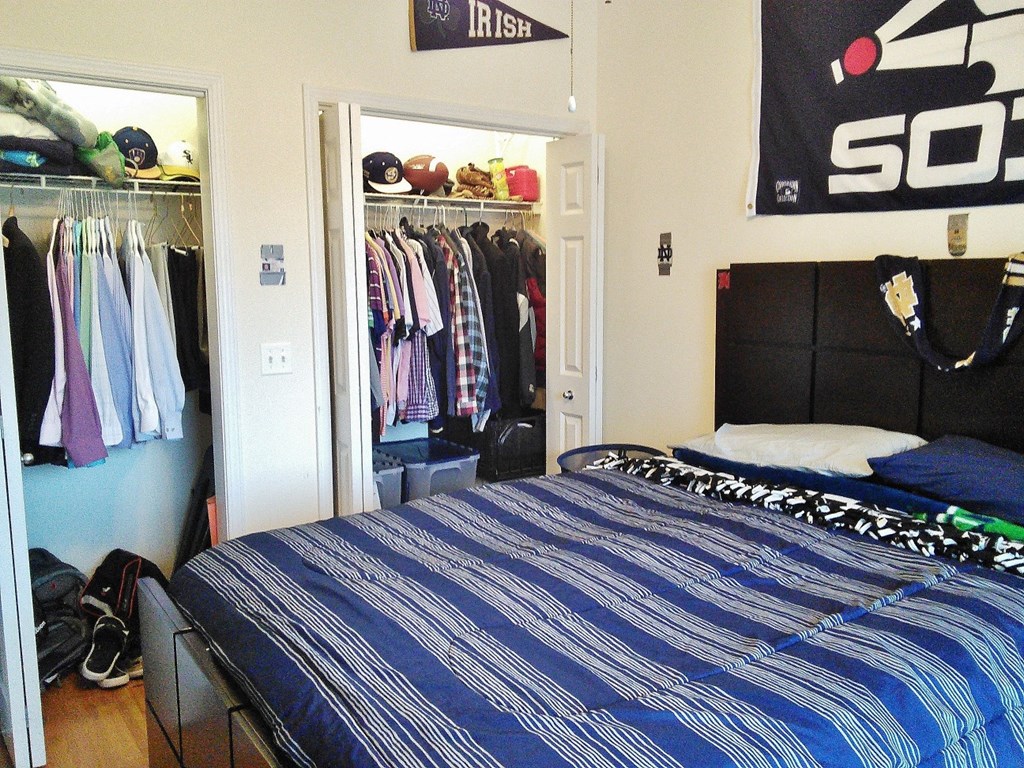 a bedroom with a bed and a closet