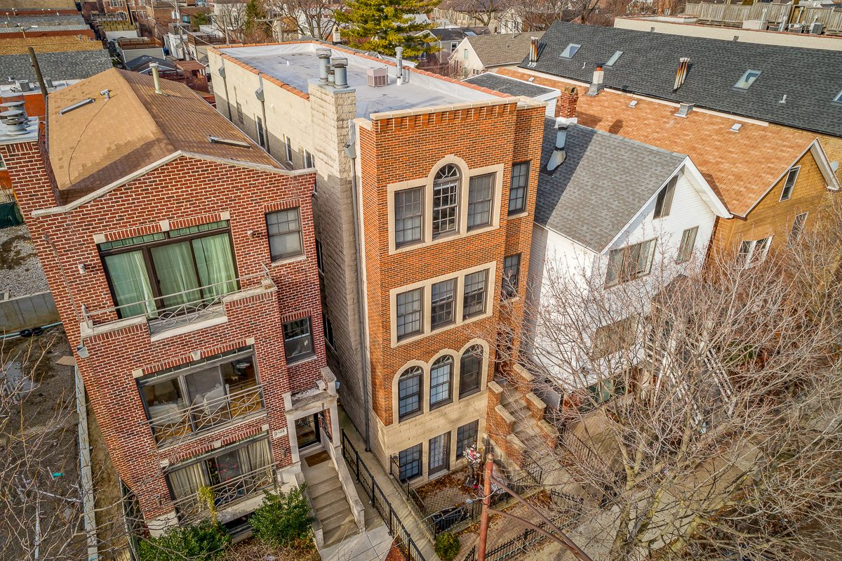 an aerial view of a cluster of buildings in the city