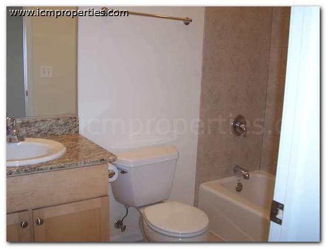 a bathroom with a toilet and a sink