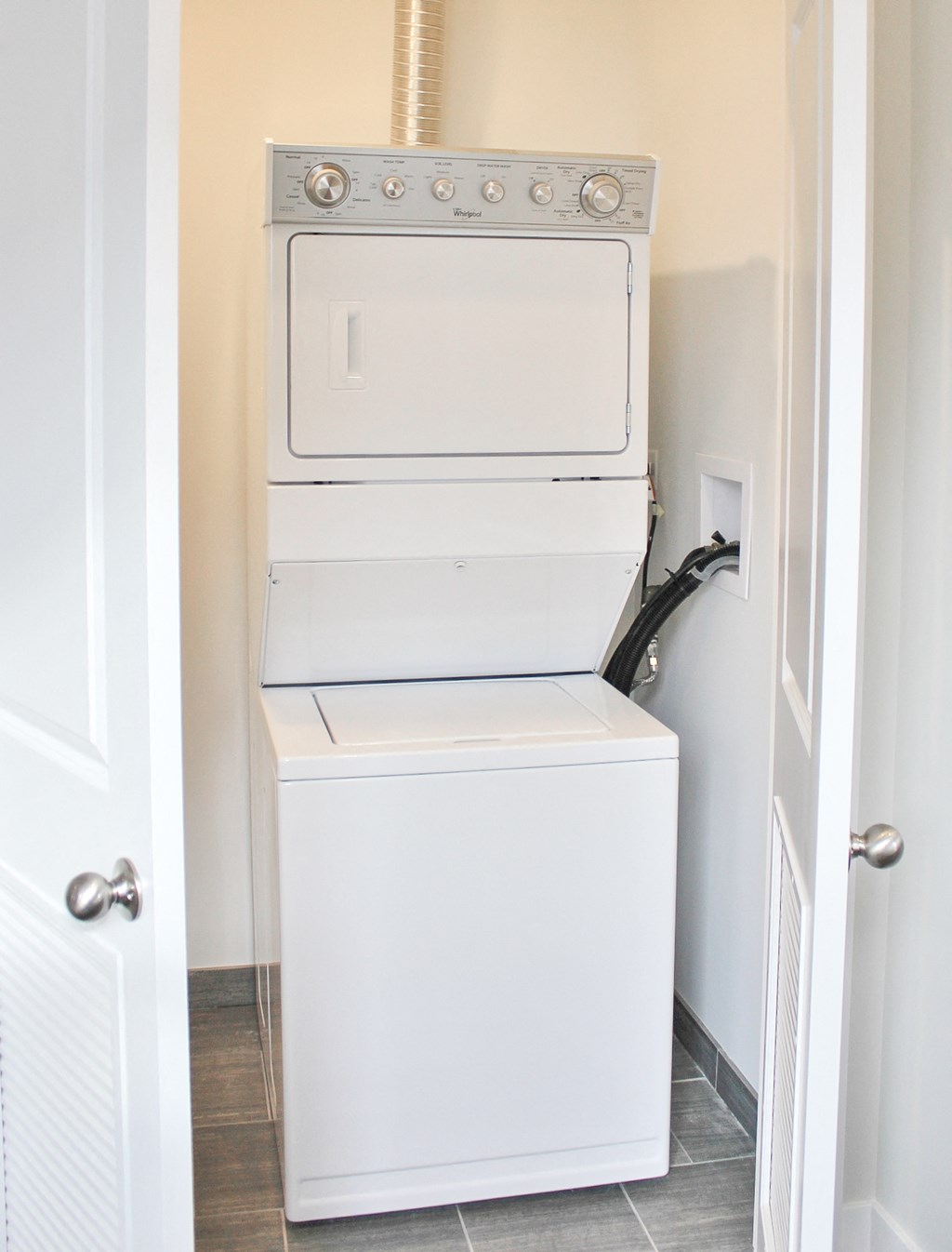 a washer and dryer in a small laundry room