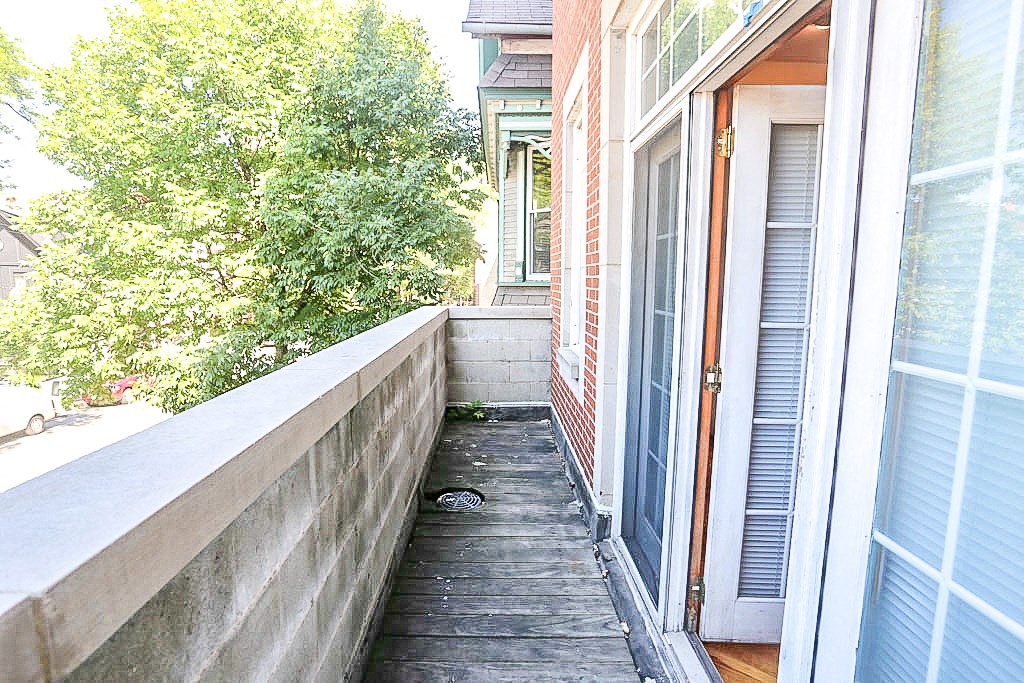 a small porch with a door to a house