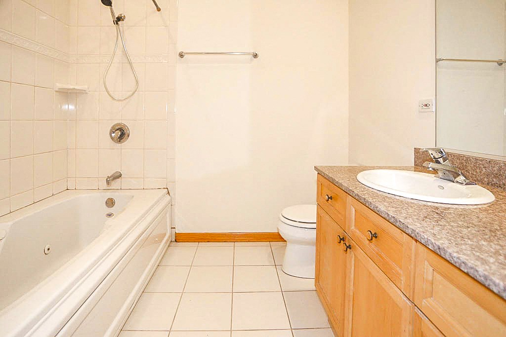 a bathroom with a sink toilet and a bath tub