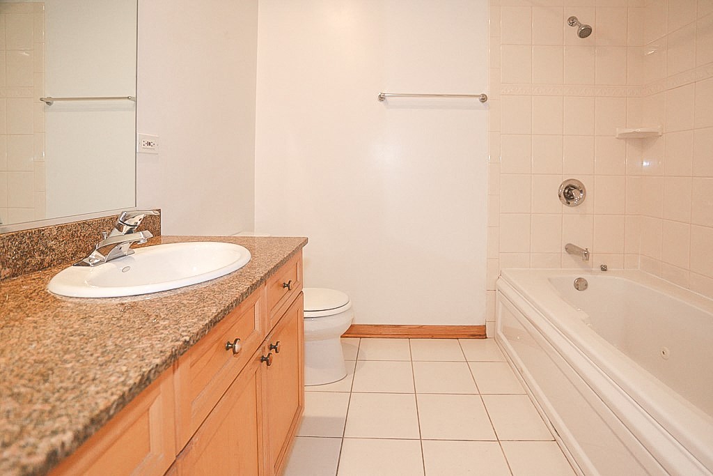 a bathroom with a sink and a toilet and a bath tub
