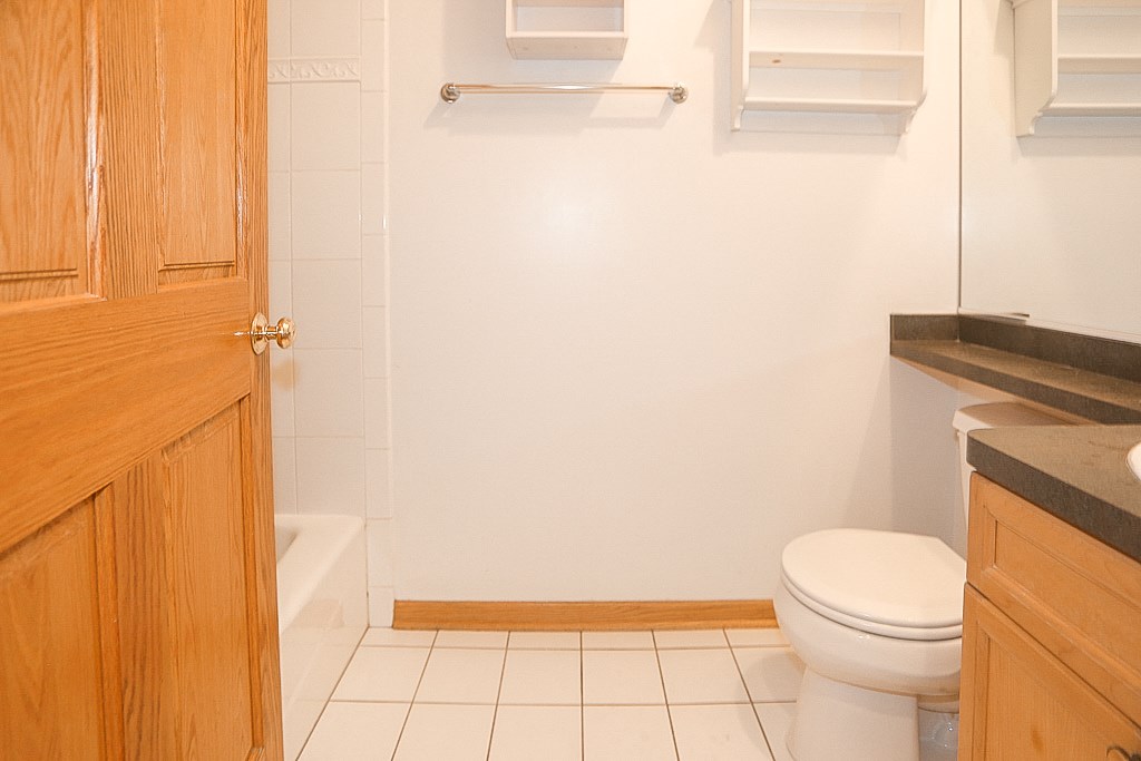 a small bathroom with a toilet and a shower