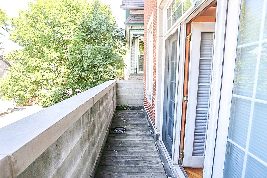 a small porch with a door to a house