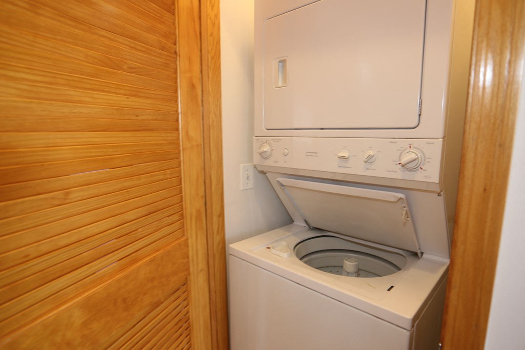 a washer and dryer in a small laundry room