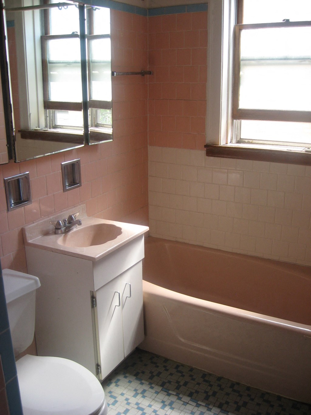 a bathroom with a sink toilet and a bath tub