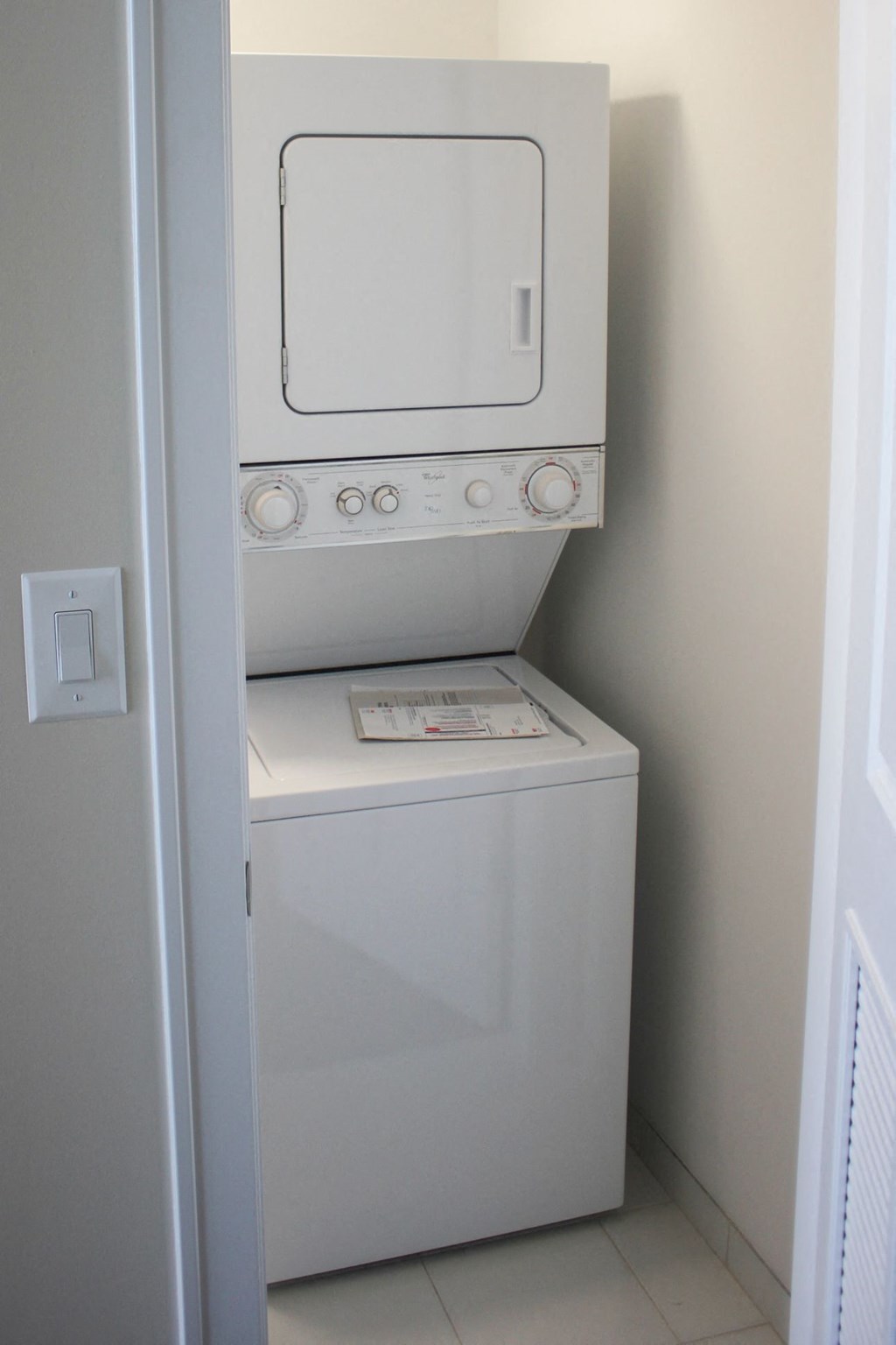 a white washer and dryer in a white room