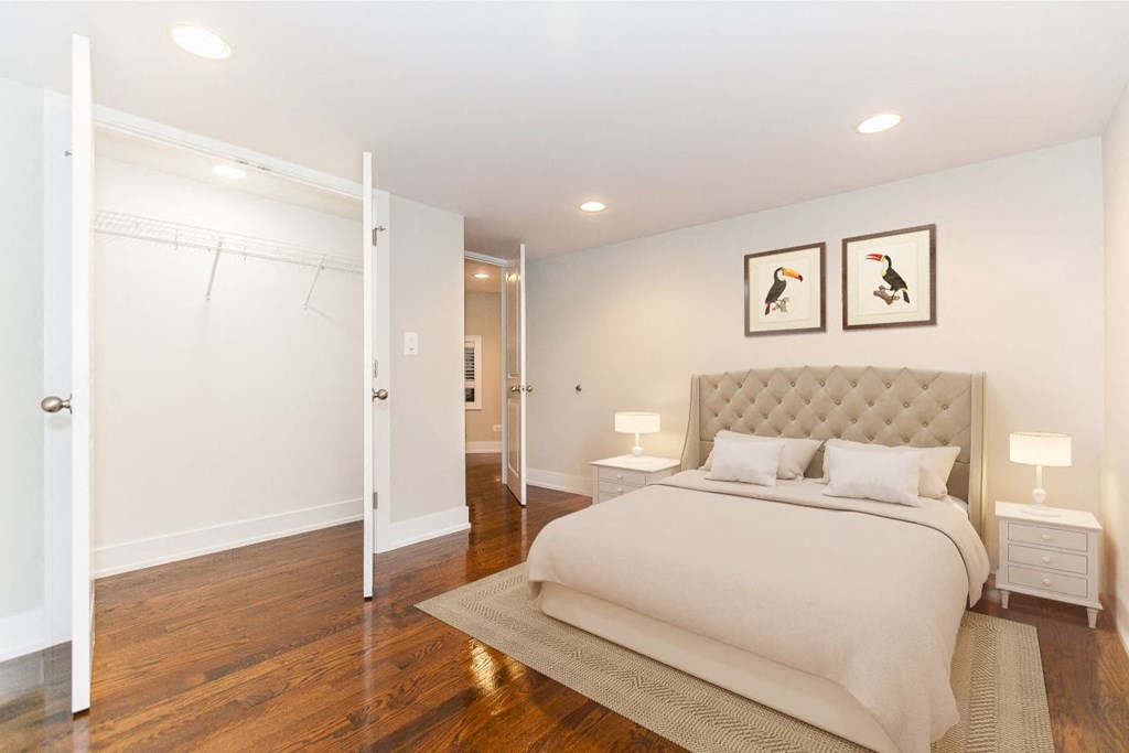 a bedroom with a bed and a closet