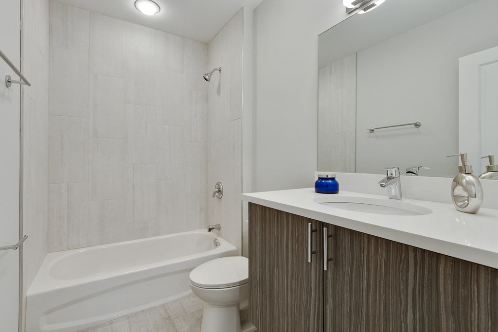 a bathroom with a sink toilet and a bath tub