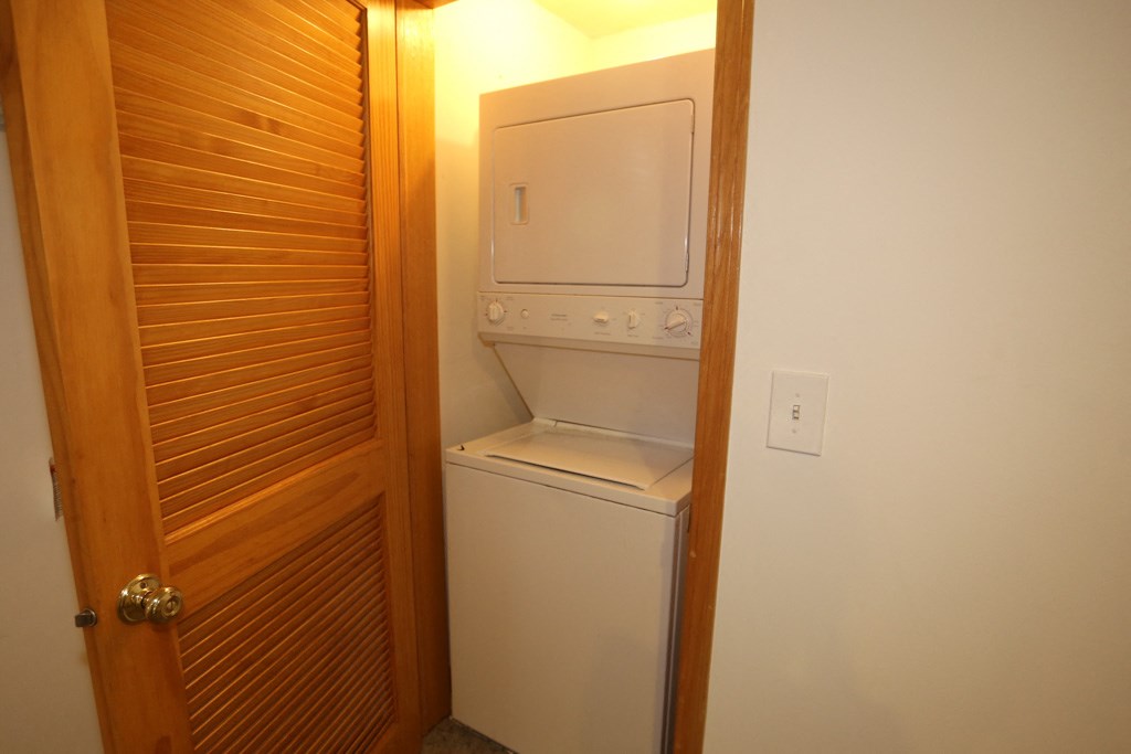 a small laundry room with a washer and dryer