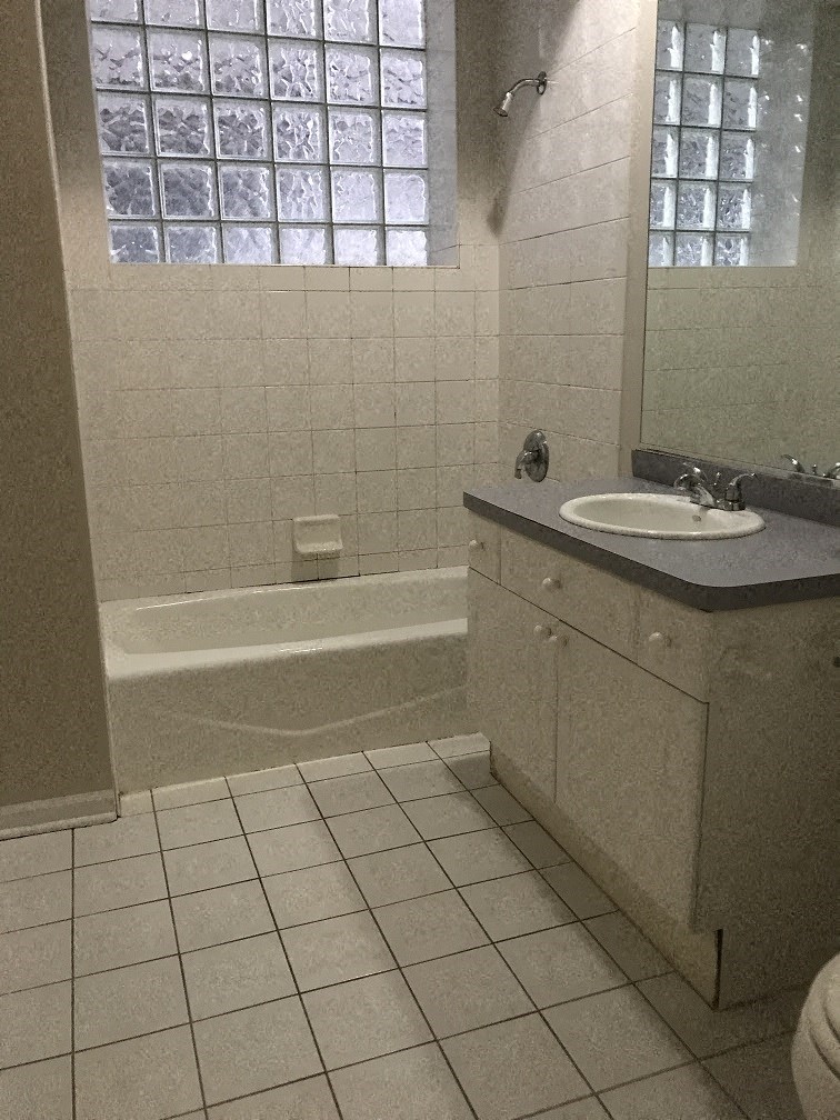 a bathroom with a sink and a bath tub