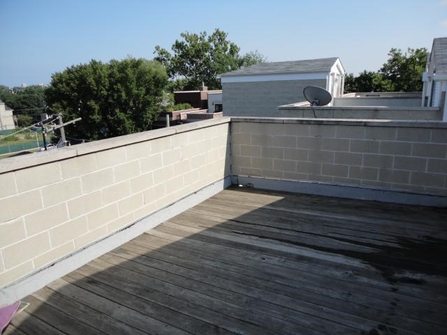 a roof of a building with a satellite dish on it