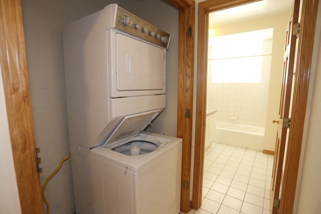 a laundry room with a washer and dryer in it