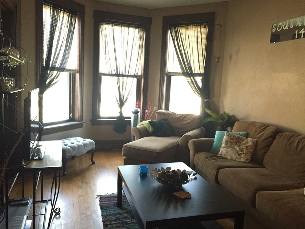 a living room with couches and a coffee table