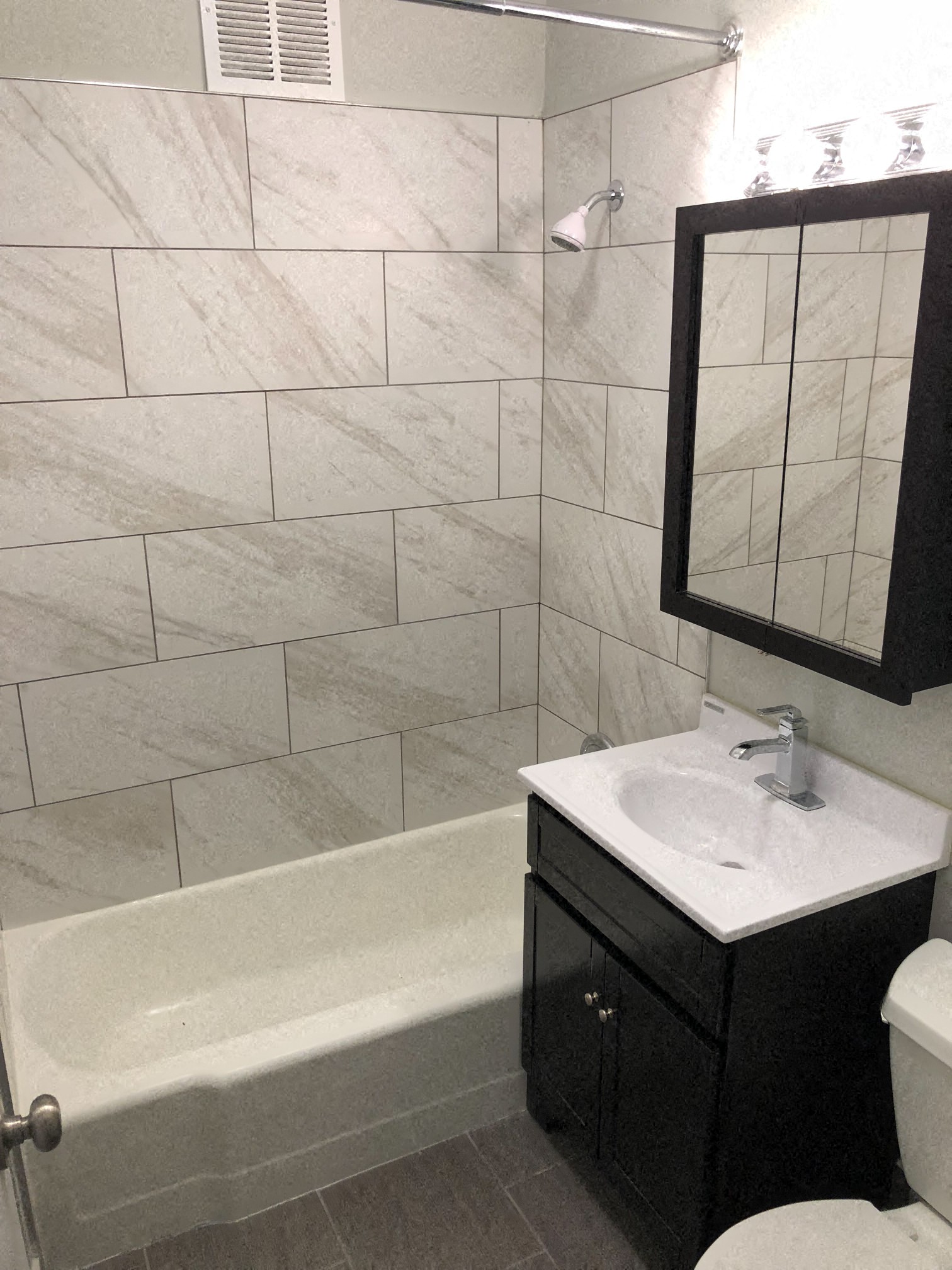 a bathroom with a sink and a bath tub