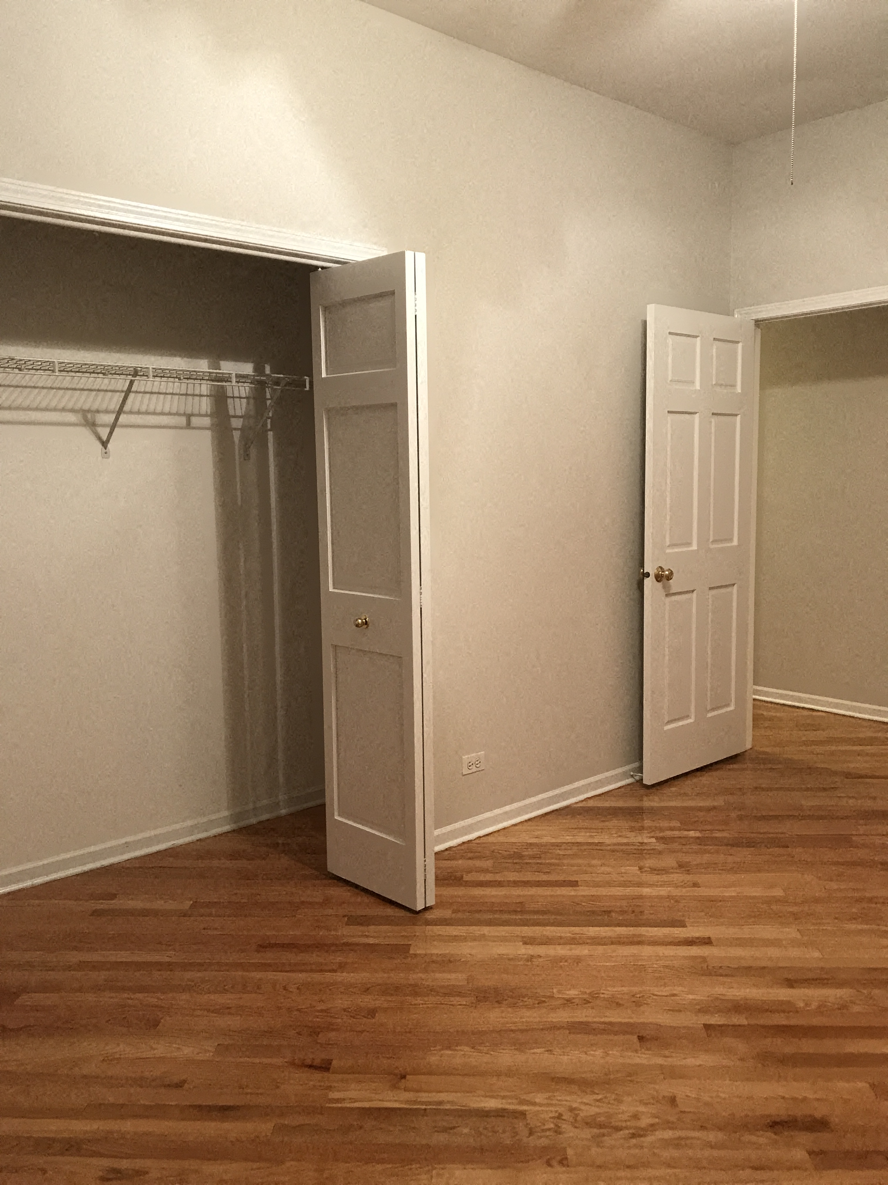 a room with a closet and an open door