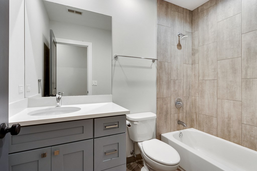the preserve at ballantyne commons apartment bathroom with sink toilet and shower