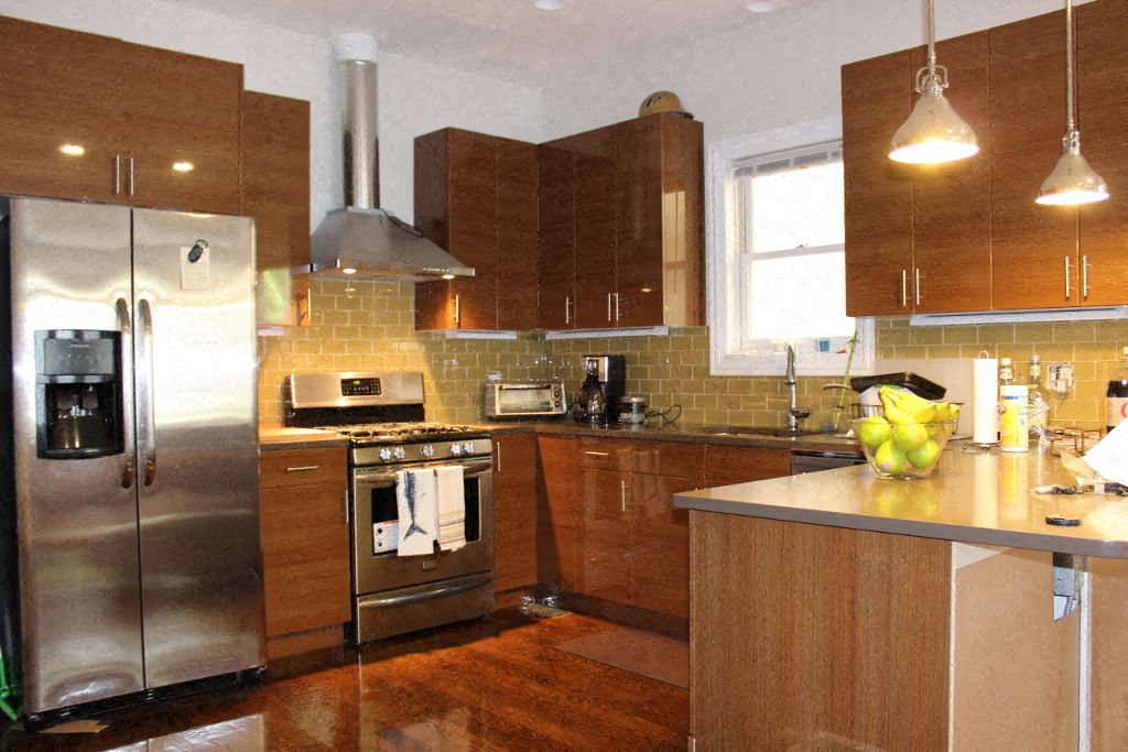 a kitchen with stainless steel appliances and wooden cabinets