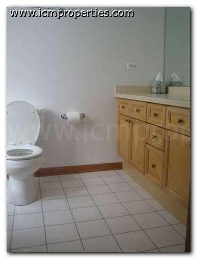 a bathroom with a toilet and a sink