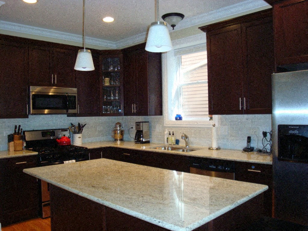 a kitchen with a white counter top