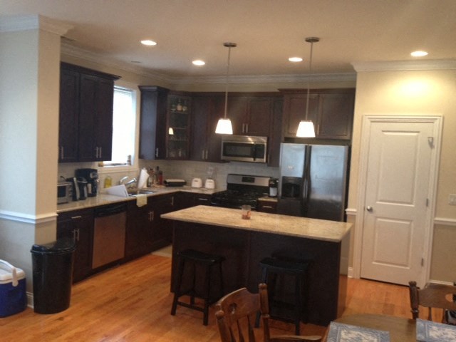 a kitchen with a counter top and a refrigerator