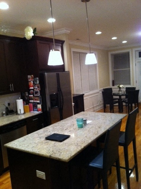 a kitchen with a counter top and a refrigerator
