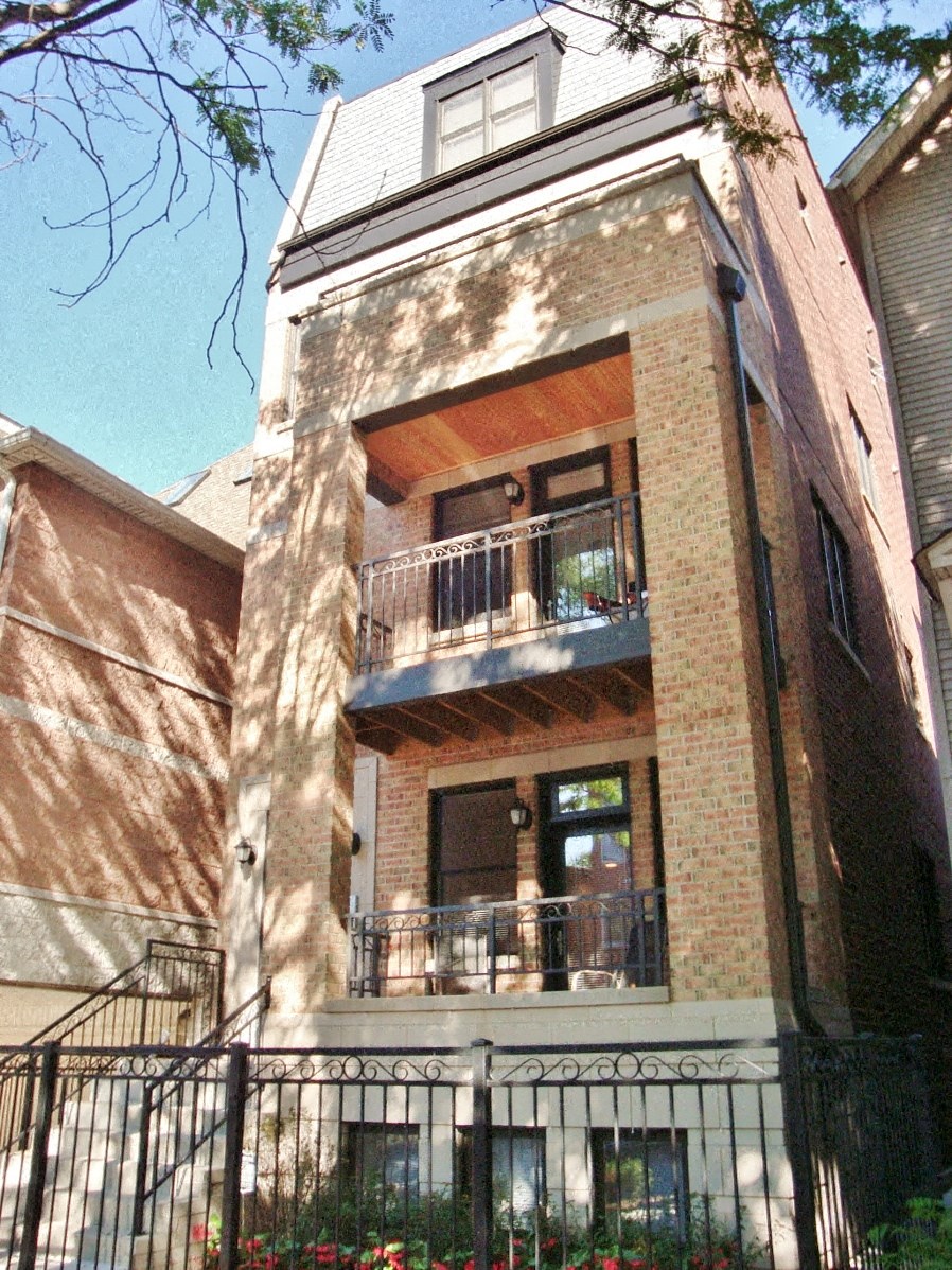 a brick building with a balcony and a