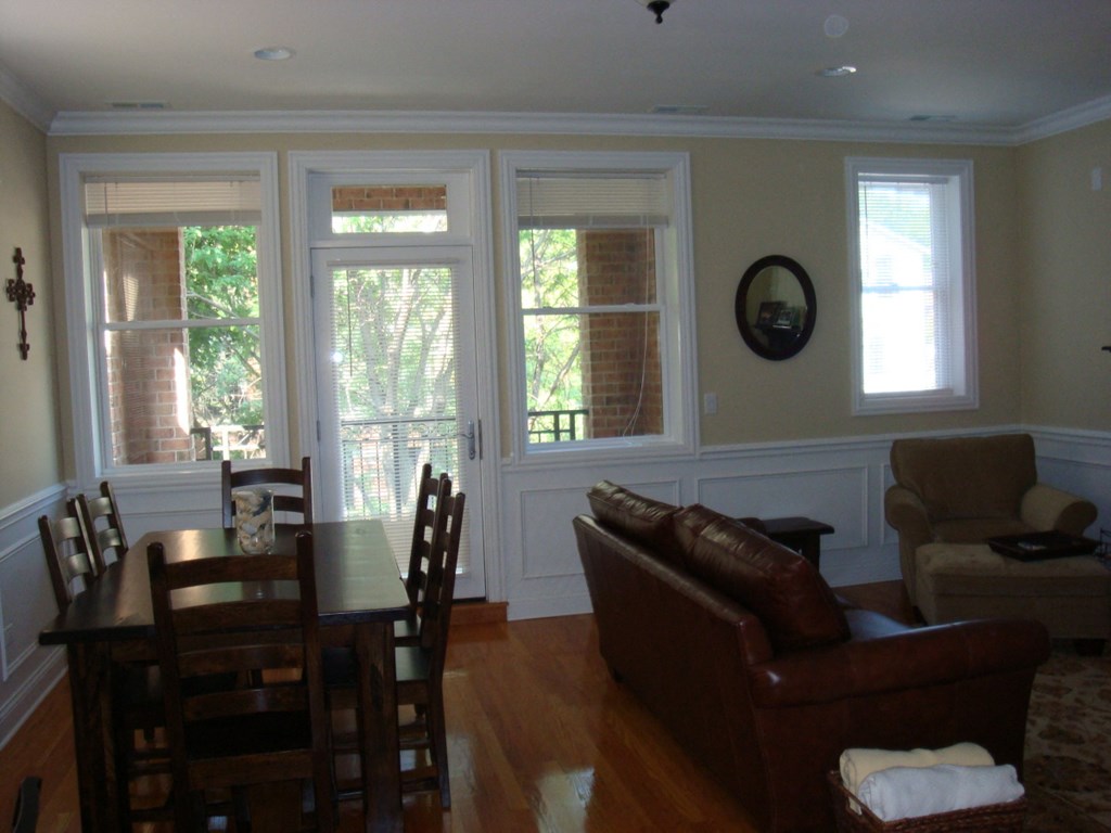 a dining room with a table and chairs and a couch