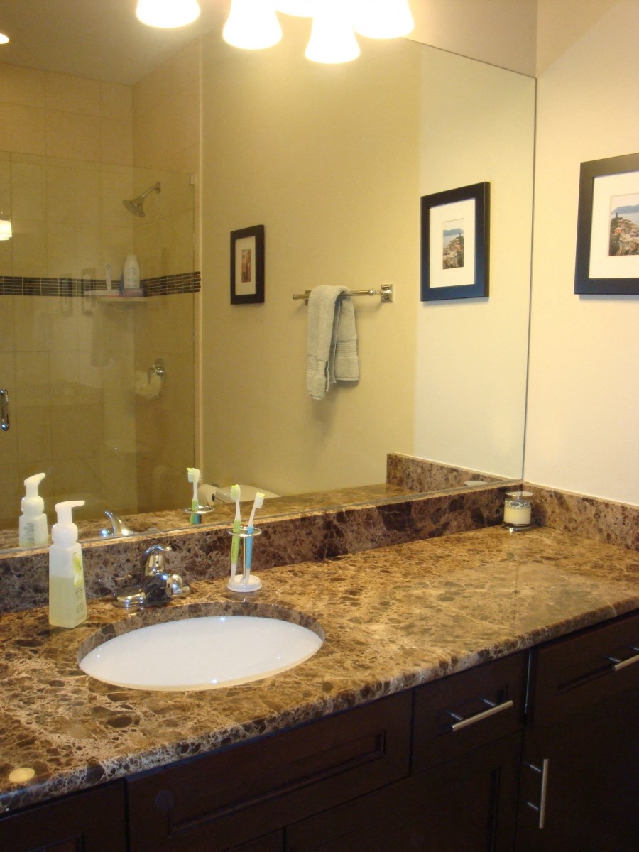 a bathroom with a sink and a large mirror