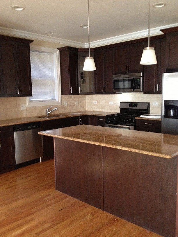 a kitchen with a counter top and a stove