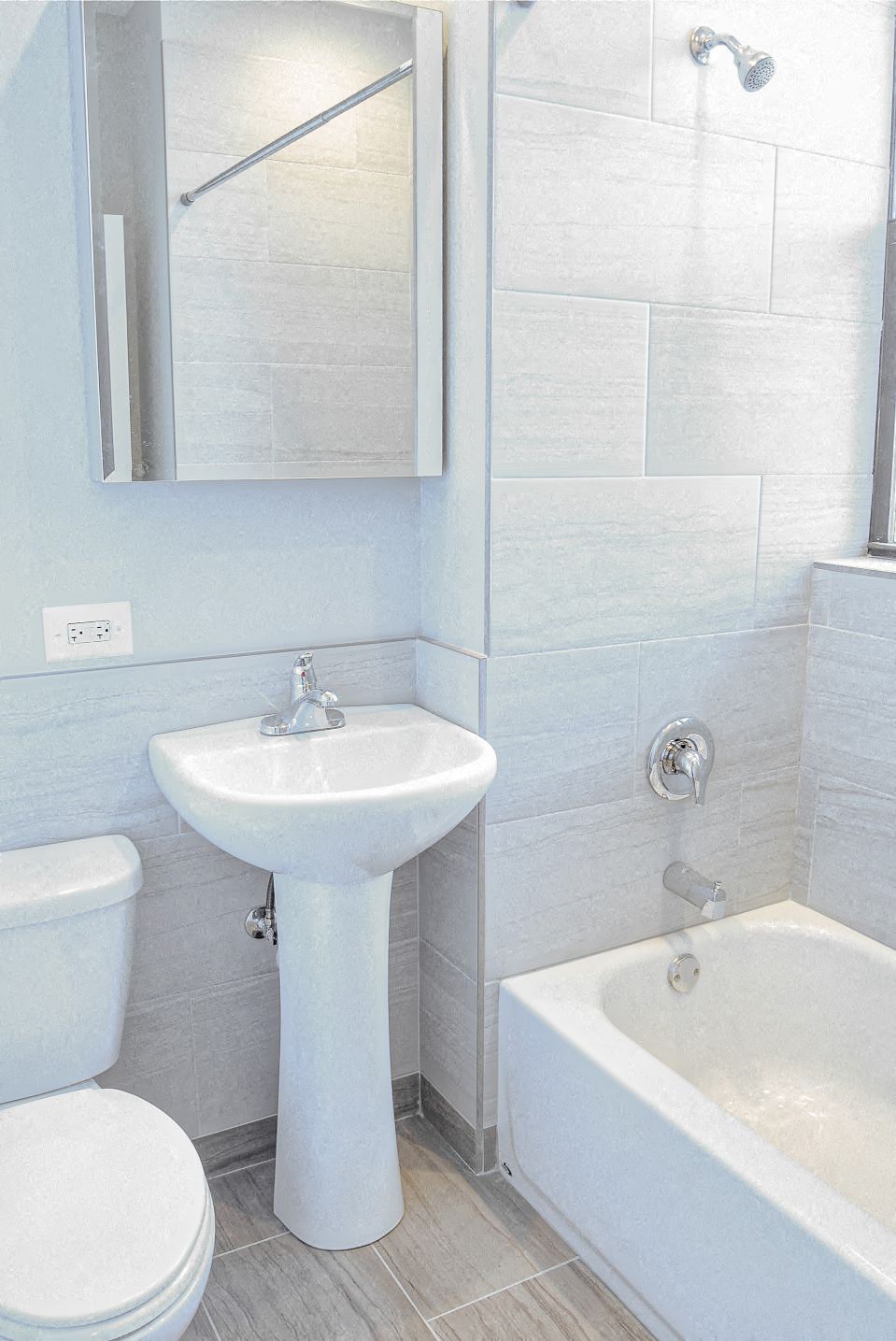 a bathroom with a sink toilet and a tub