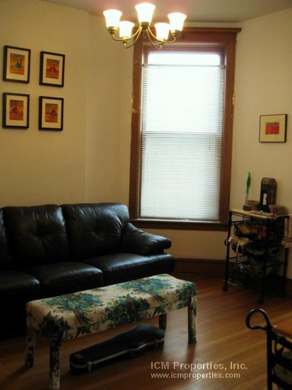 a living room with a leather couch and a