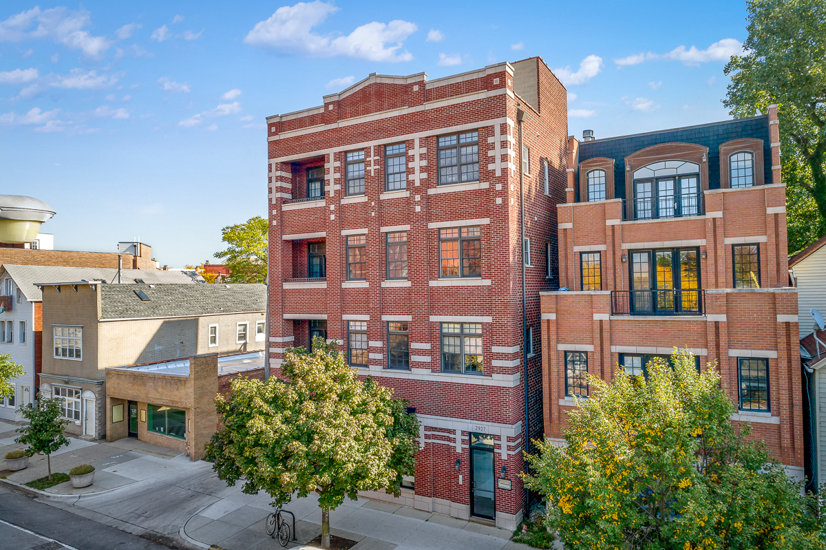 a red brick building with trees in front of it