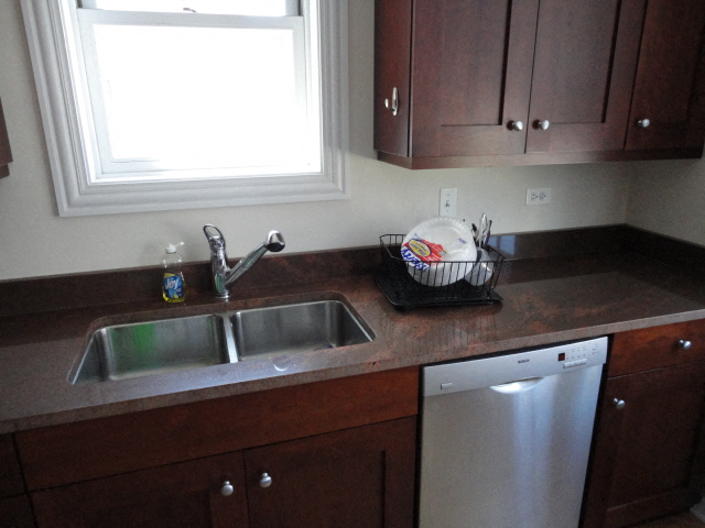 a kitchen with a sink and a window
