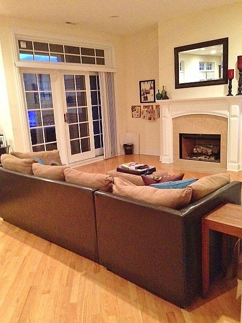 a living room with a couch and a fireplace