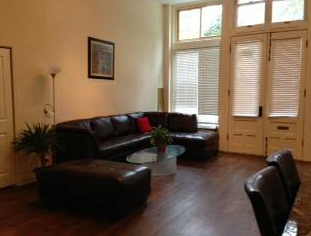 a living room with leather couches and a coffee table