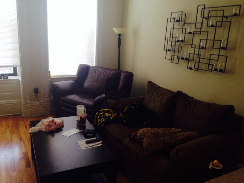 a living room with couches and a coffee table