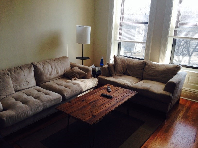 a living room with couches and a coffee table
