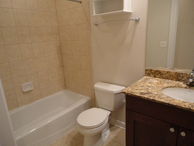 a bathroom with a sink toilet and a bath tub