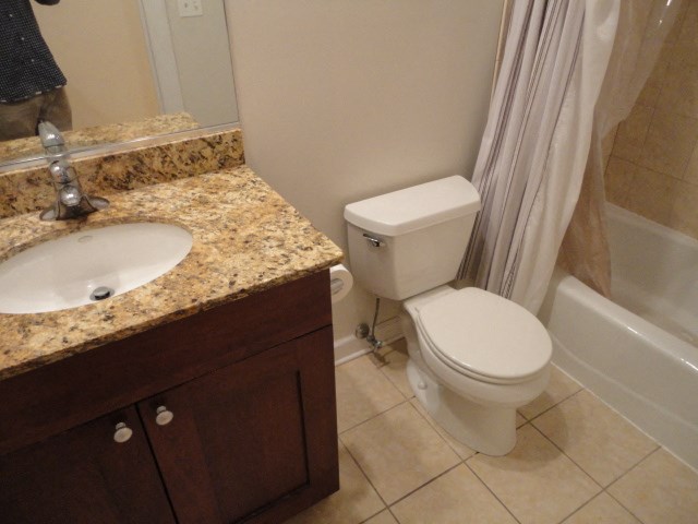 a bathroom with a toilet and a sink