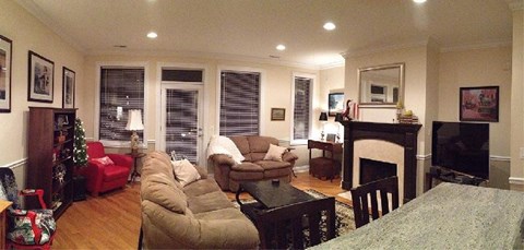 a living room with a fireplace and a couch