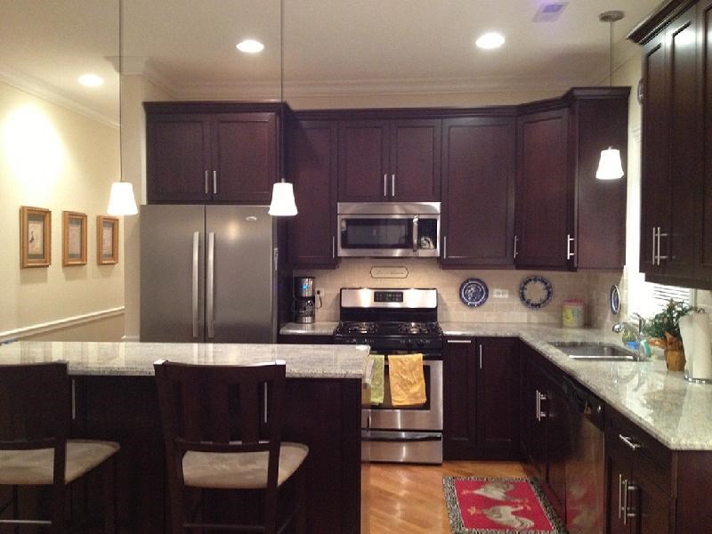 a kitchen with stainless steel appliances and granite counter tops