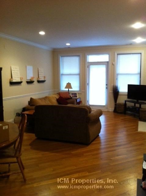 a living room with a couch and a table