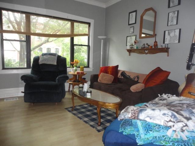 a living room with a couch and a chair